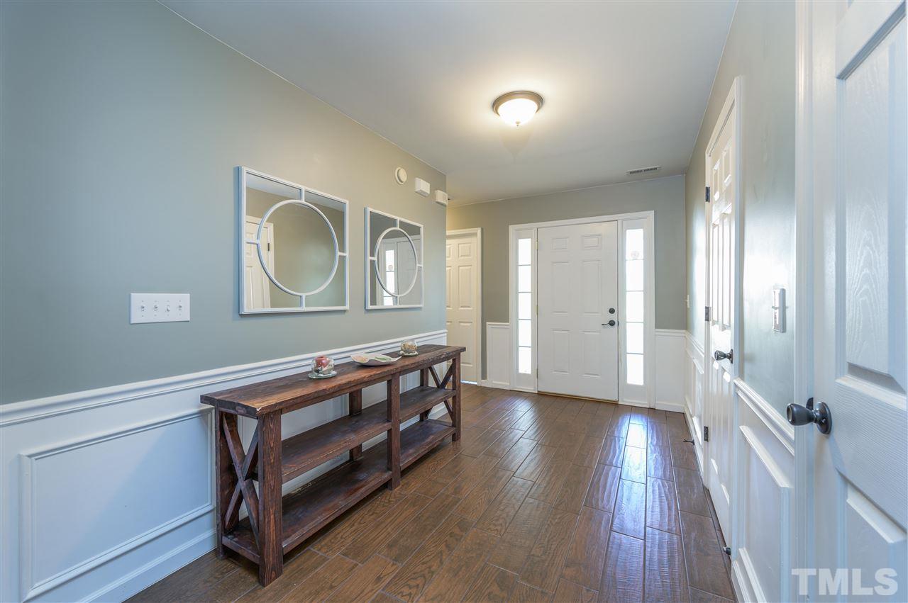 4520 Drewbridge Way Raleigh, NC 27604 - Photo 2 of 22 a view of a room with wooden floor and window