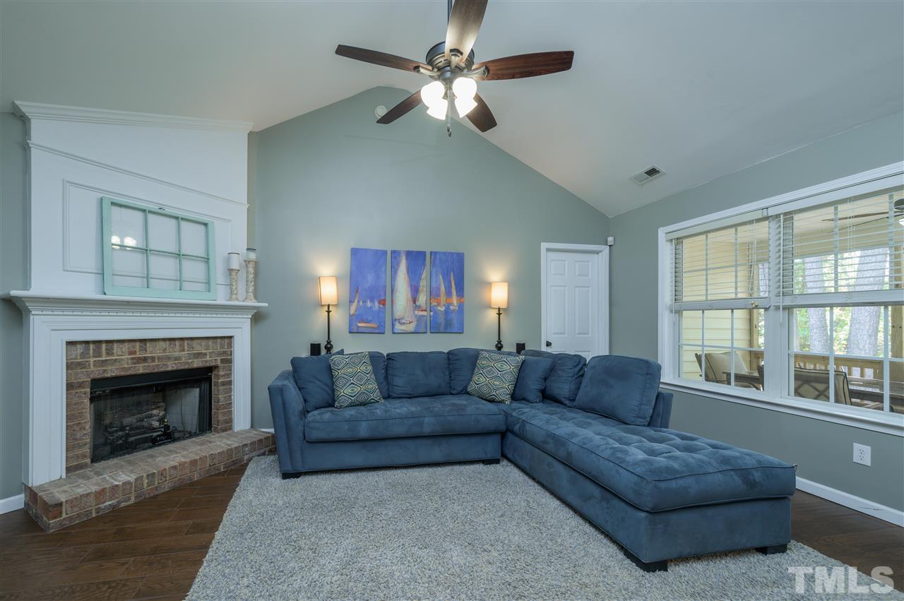 4520 Drewbridge Way Raleigh, NC 27604 - Photo 3 of 22 a living room with furniture and a fireplace