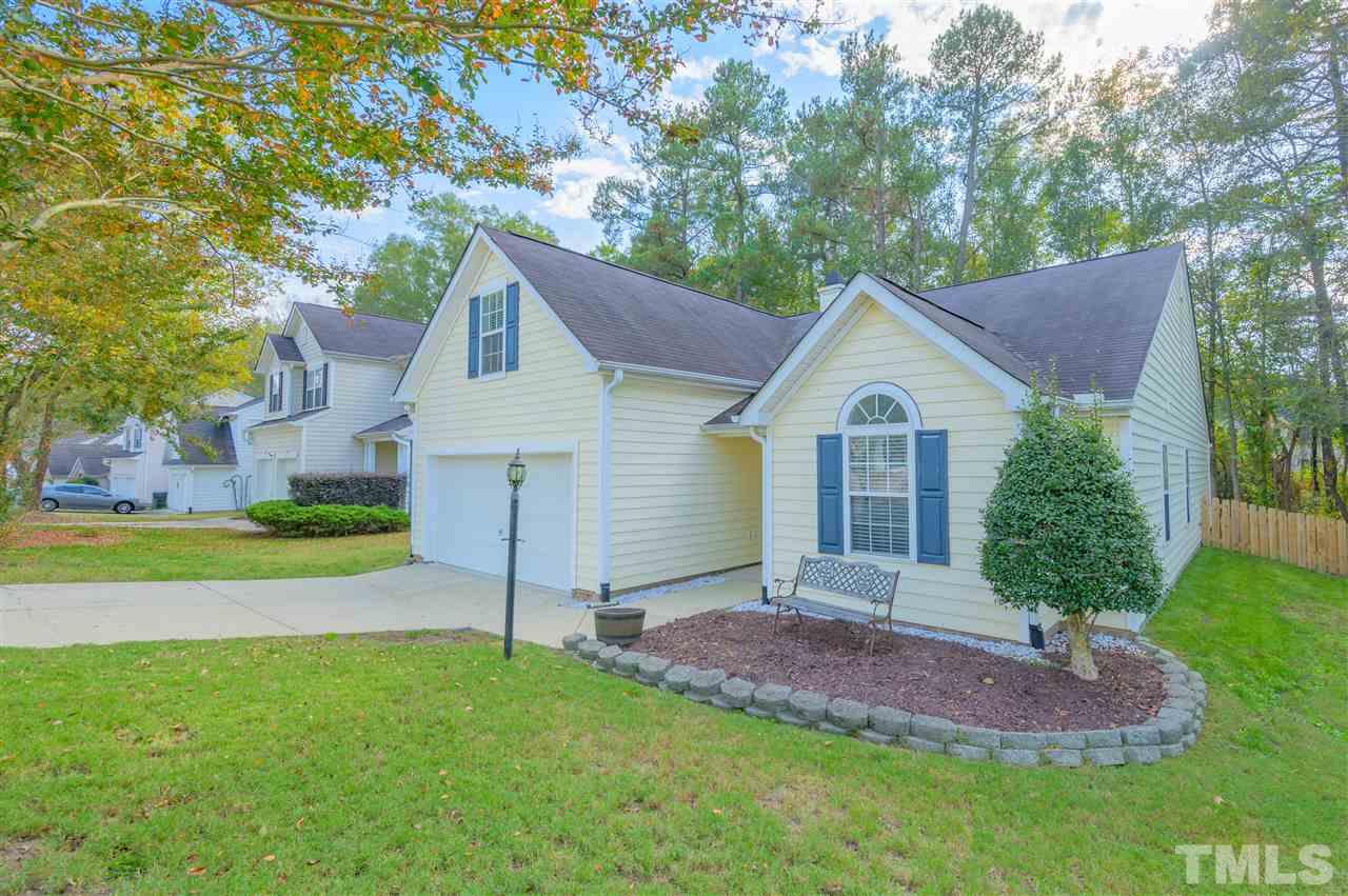 4520 Drewbridge Way Raleigh, NC 27604 - Photo 21 of 22 a front view of a house with a yard and garage