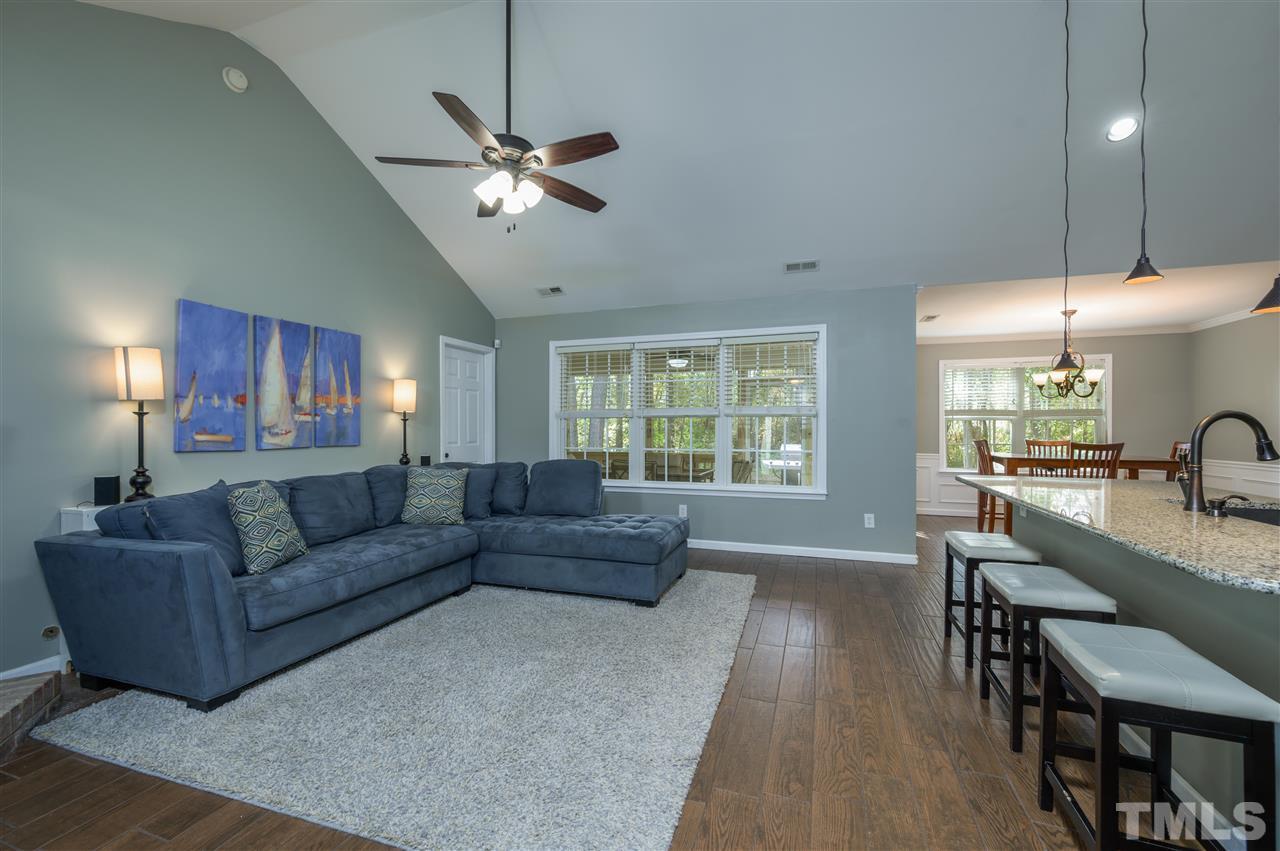 4520 Drewbridge Way Raleigh, NC 27604 - Photo 7 of 22 a living room with furniture and a large window