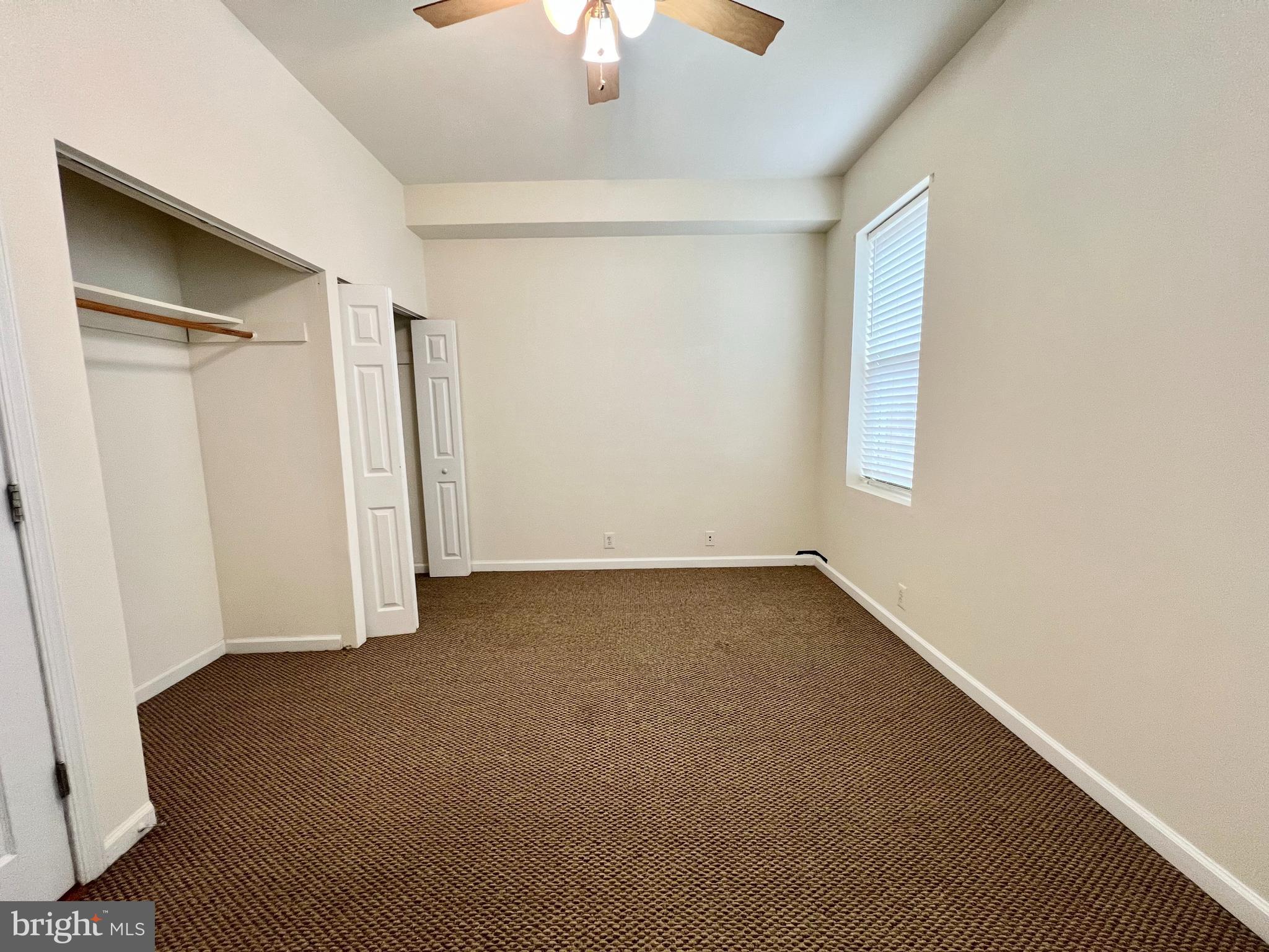 1828 Willington Street Philadelphia, PA 19121 - Photo 5 of 9 an empty room with a empty space and a ceiling fan