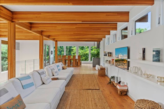 a living room with furniture and a table
