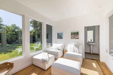 a living room with furniture and a yard