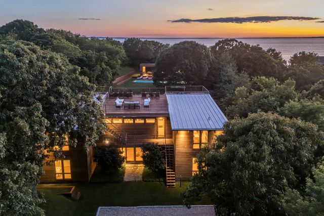 a view of houses with an outdoor space and lakeside