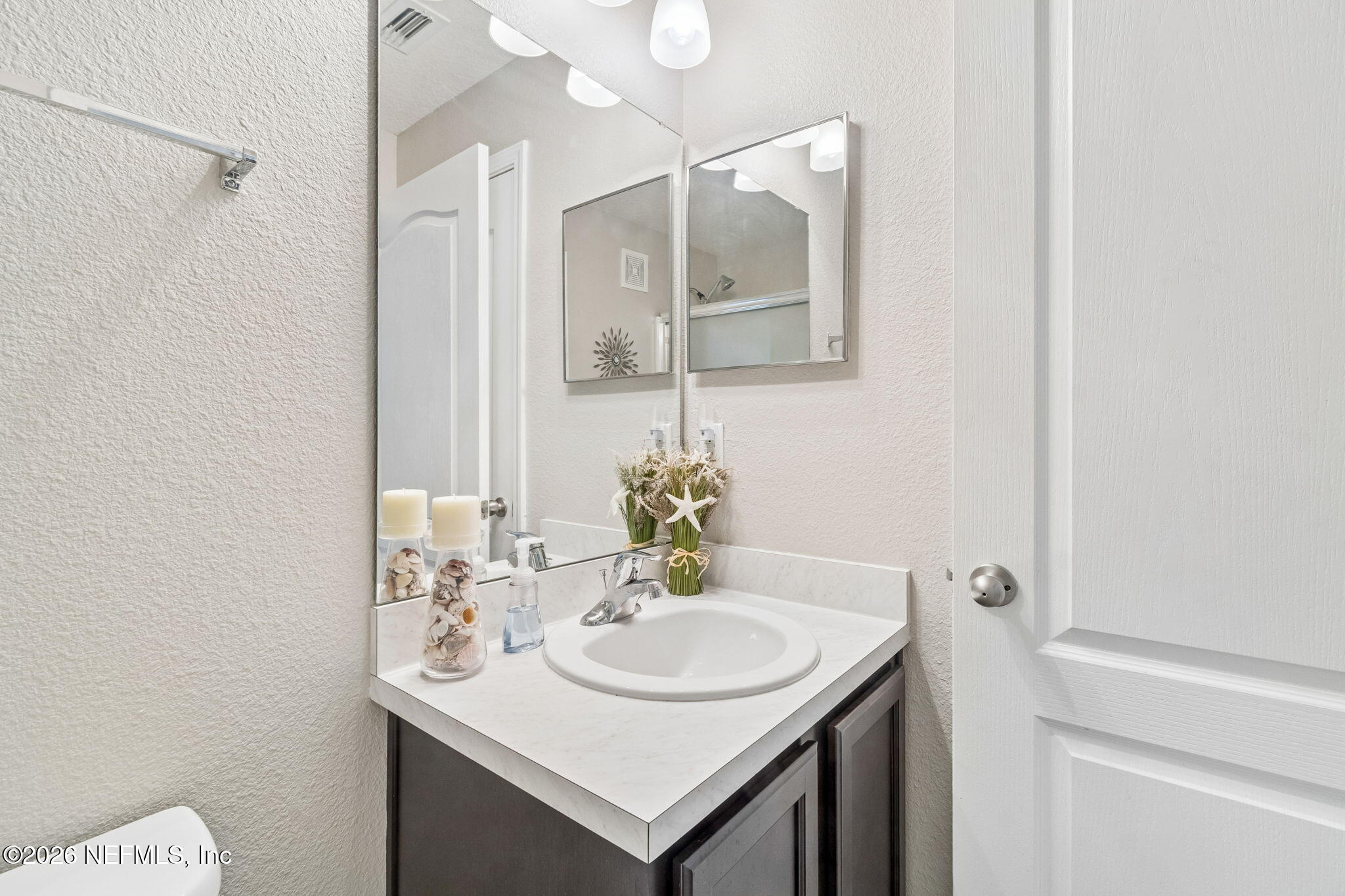 2113 Golden Lake Loop St. Augustine, FL 32084 - Photo 29 of 50 a bathroom with a sink and a mirror