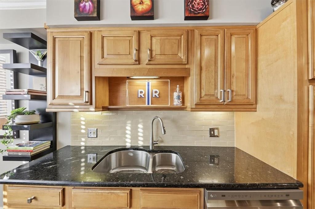 3530 Piedmont Road Northeast, Unit F2 Atlanta, GA 30305 - Photo 14 of 50 a kitchen with granite countertop a sink and cabinets