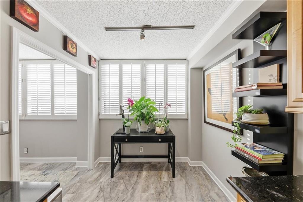 3530 Piedmont Road Northeast, Unit F2 Atlanta, GA 30305 - Photo 19 of 50 a living room with furniture and a potted plant