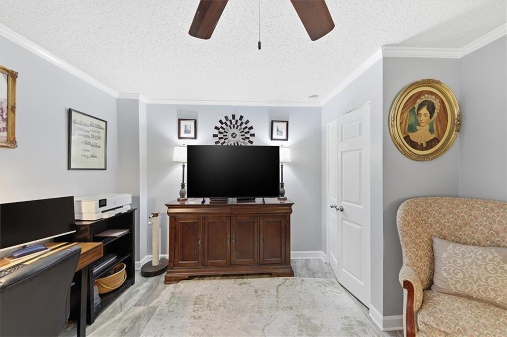 3530 Piedmont Road Northeast, Unit F2 Atlanta, GA 30305 - Photo 25 of 50 a living room with furniture and a flat screen tv