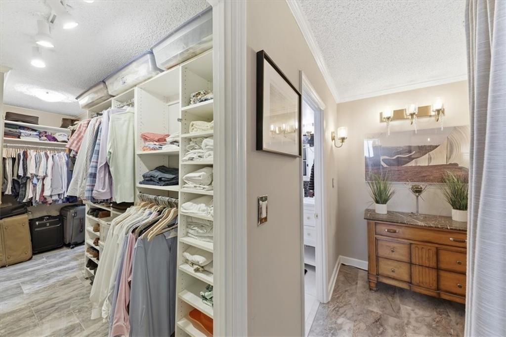 3530 Piedmont Road Northeast, Unit F2 Atlanta, GA 30305 - Photo 26 of 50 a view of walk in closet with clothes and shoes