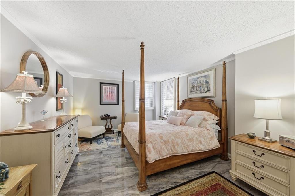 3530 Piedmont Road Northeast, Unit F2 Atlanta, GA 30305 - Photo 28 of 50 a bedroom with a bed and wooden floor