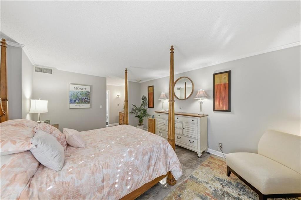 3530 Piedmont Road Northeast, Unit F2 Atlanta, GA 30305 - Photo 31 of 50 a bedroom with a bed and cabinets