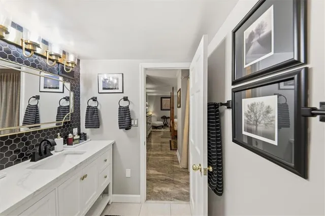 a bathroom with a double vanity sink and mirror