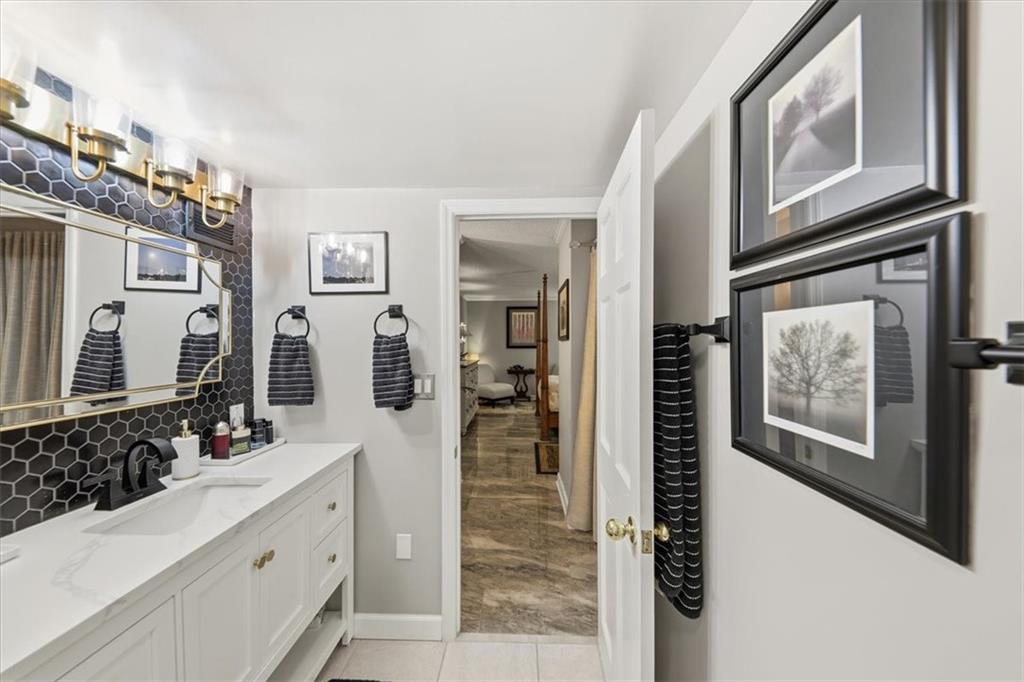 3530 Piedmont Road Northeast, Unit F2 Atlanta, GA 30305 - Photo 34 of 50 a bathroom with a double vanity sink and mirror