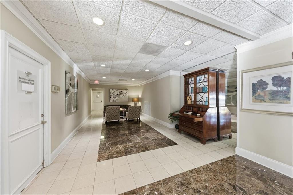 3530 Piedmont Road Northeast, Unit F2 Atlanta, GA 30305 - Photo 38 of 50 a living room with furniture and a rug