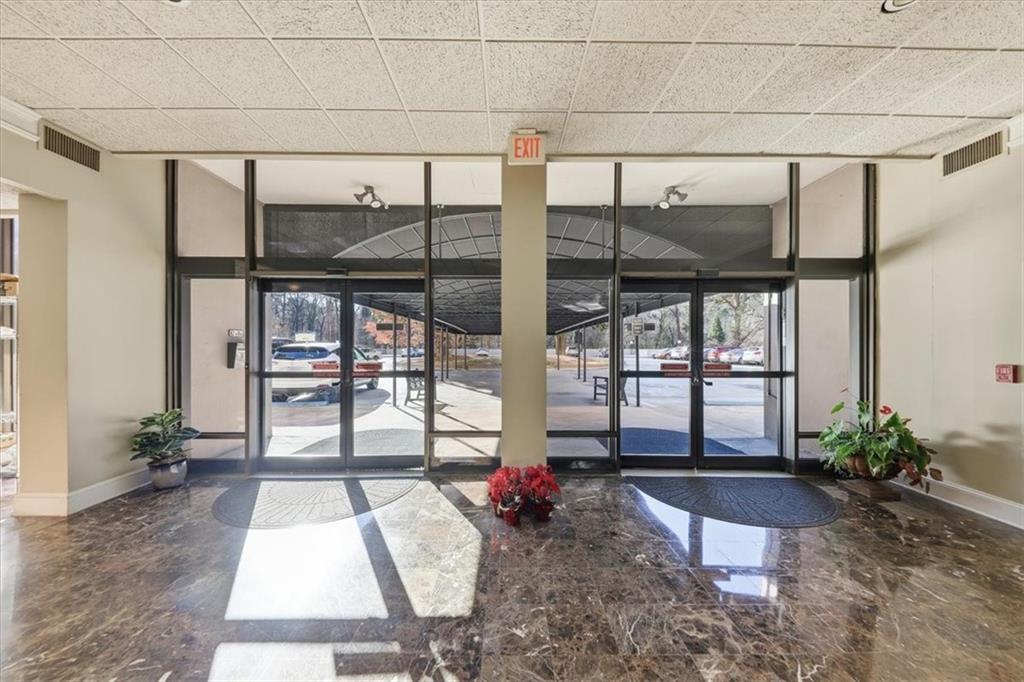 3530 Piedmont Road Northeast, Unit F2 Atlanta, GA 30305 - Photo 41 of 50 a living room filled with furniture