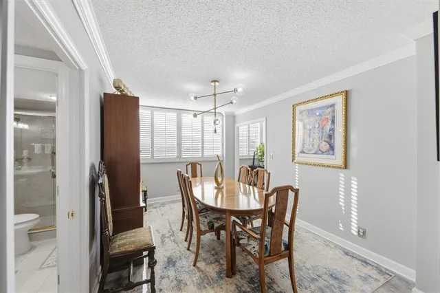 a view of a dining room with furniture and window