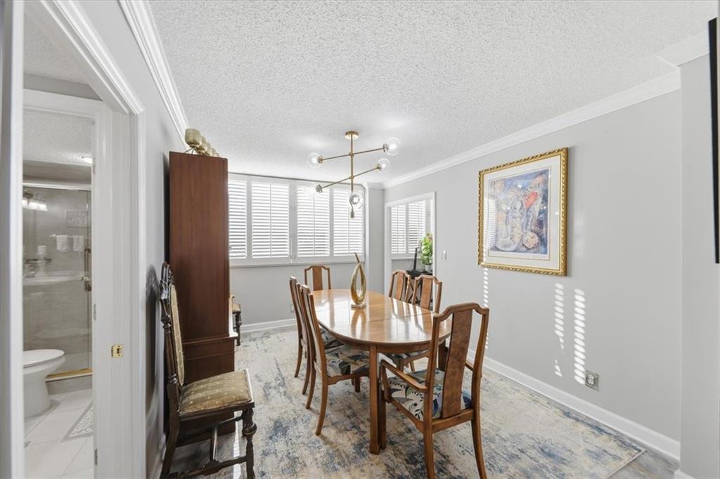 3530 Piedmont Road Northeast, Unit F2 Atlanta, GA 30305 - Photo 9 of 50 a view of a dining room with furniture and window