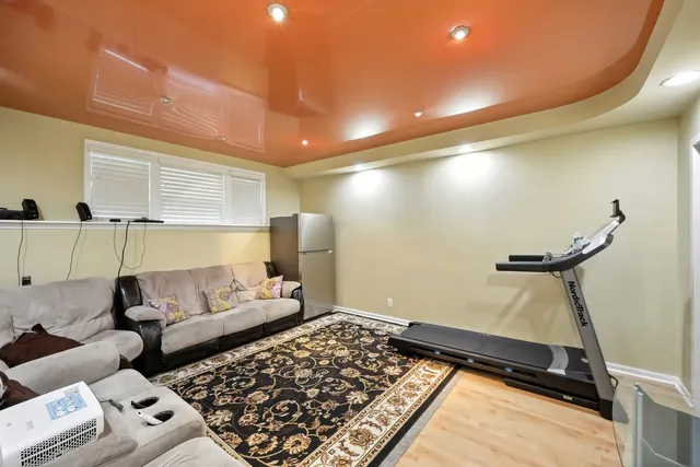 a living room with furniture and a rug