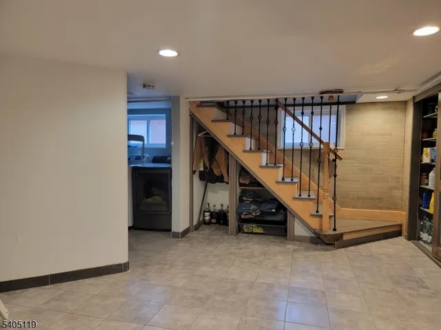 a view of staircase with furniture and stairs