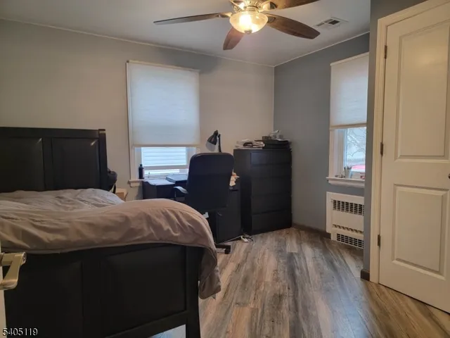 a bedroom with a bed and dresser