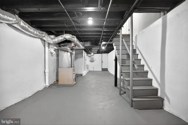 a front view of a residential apartment building with a yard