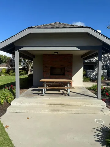 a view of garage with a chair and a fireplace