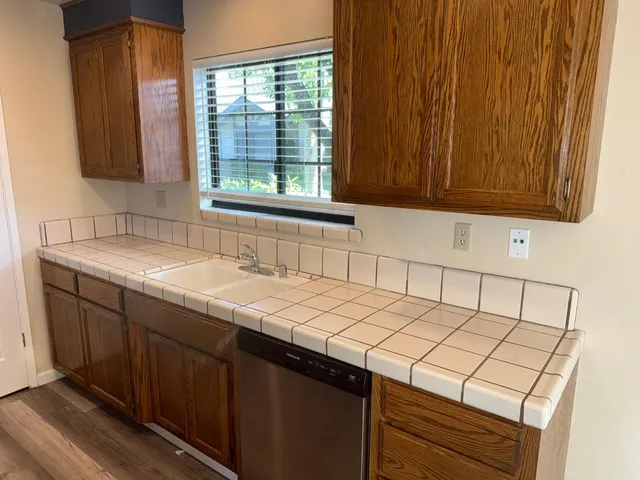 a kitchen with a sink and a window