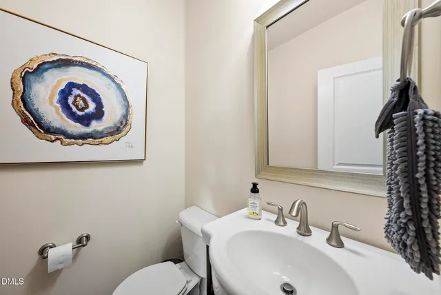 a bathroom with a toilet and a sink