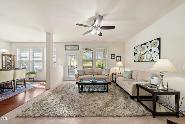 a living room with furniture and a rug