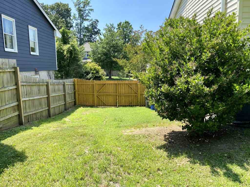 1504 North King Charles Road Raleigh, NC 27610 - Photo 14 of 28 Has a Double Door Entry Area that can fit a full size SUV. The backyard is really big in comparison to other lot within this area of Raleigh Side Yard