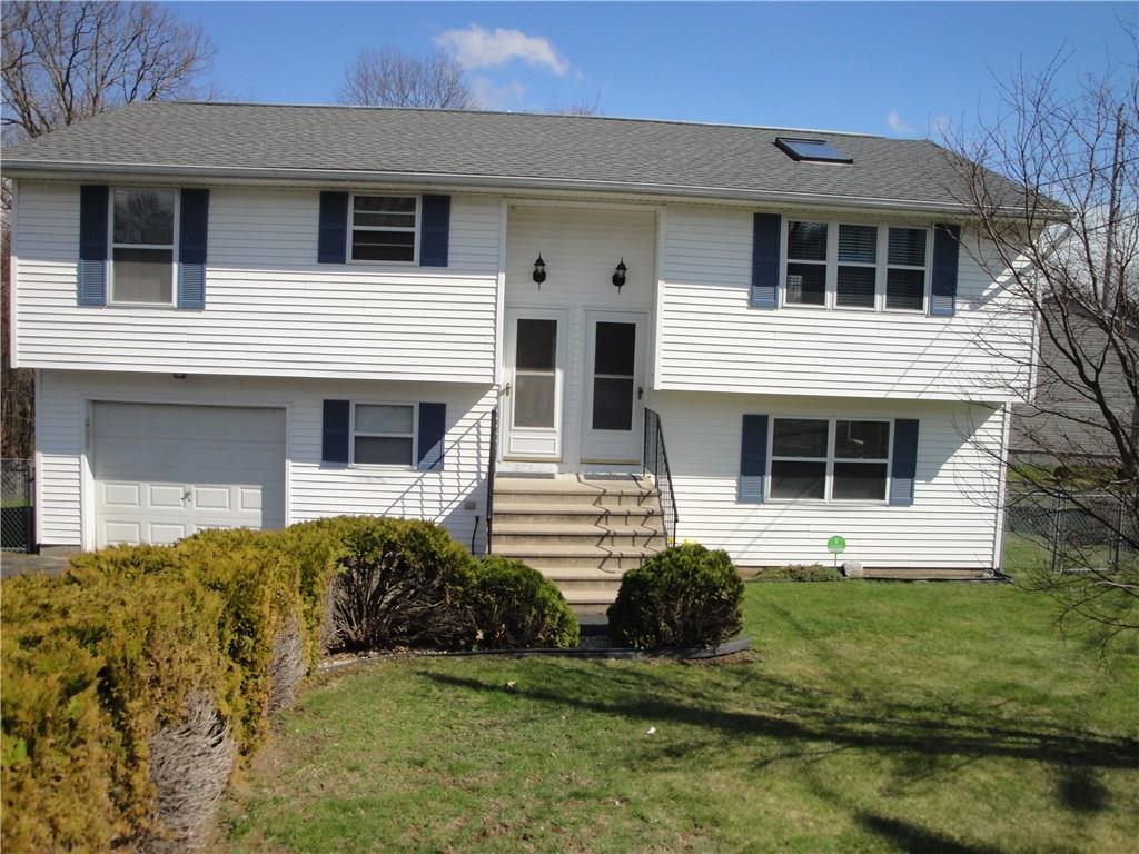 12 Jonathan Court Waterbury, CT 06708 - Photo 1 of 1 a front view of a house with a yard