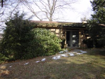 a view of a building with a tree