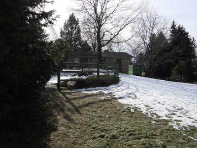 5905 Old Carriage Road Bath, PA 18014 - Photo 2 of 6 a view of a backyard with a snow