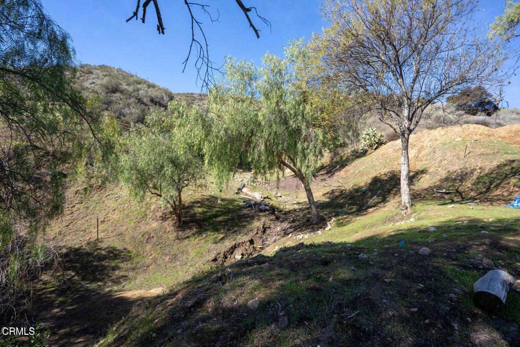 5946 Oak Knolls Road Simi Valley, CA 93063 - Photo 16 of 18 a view of a yard covered with snow