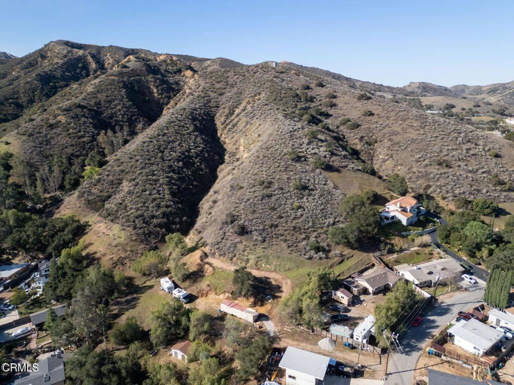 5946 Oak Knolls Road Simi Valley, CA 93063 - Photo 4 of 18 an aerial view of mountain with residential house and mountains in the background