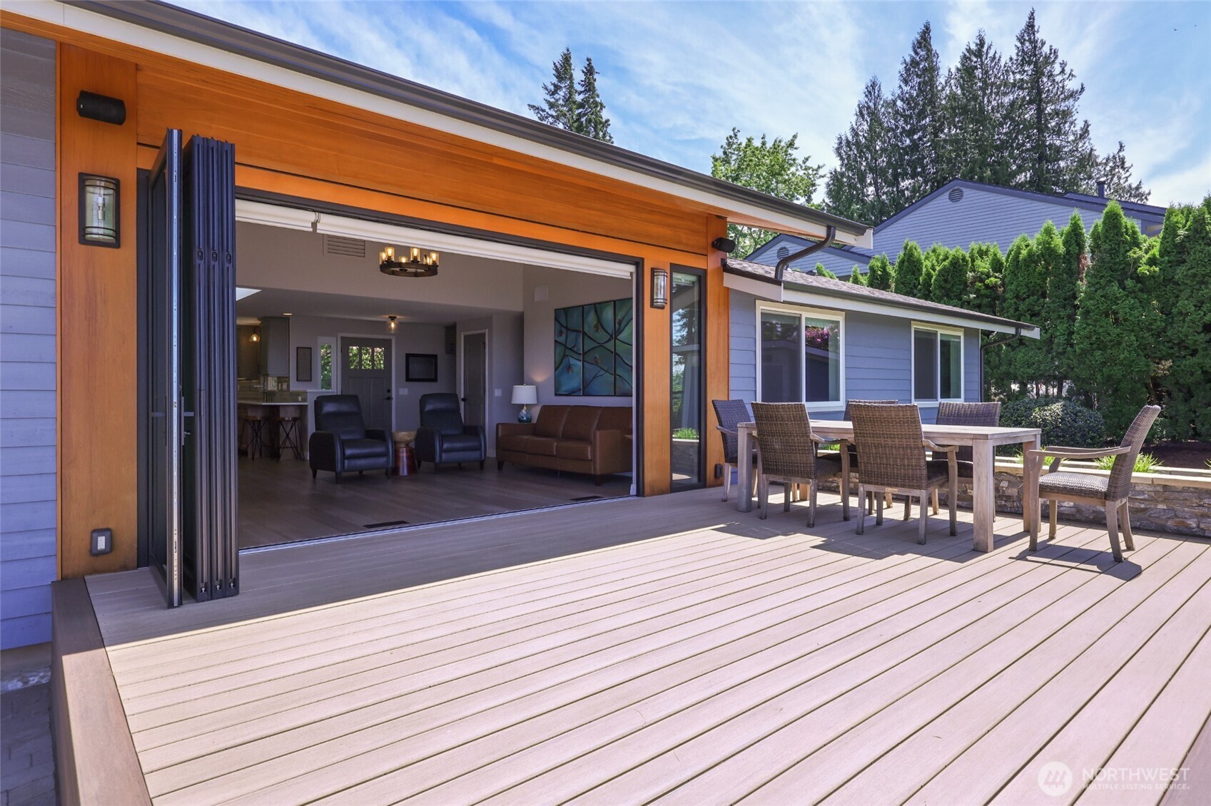7713 78th Loop Northwest Olympia, WA 98502 - Photo 6 of 40 a patio outdoor space with furniture and wooden floor