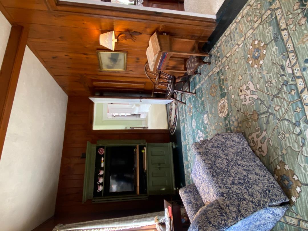 70 Spring Street Vineyard Haven, MA 02568 - Photo 18 of 68 a living room with a couch and a dresser next to a window