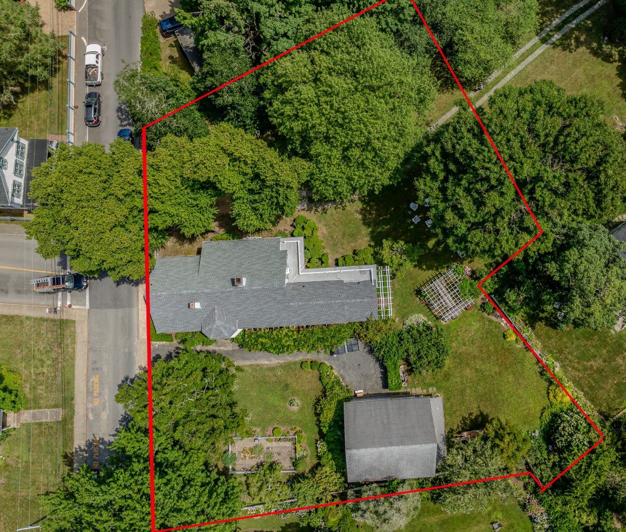 70 Spring Street Vineyard Haven, MA 02568 - Photo 31 of 68 an aerial view of a house with a yard and garden