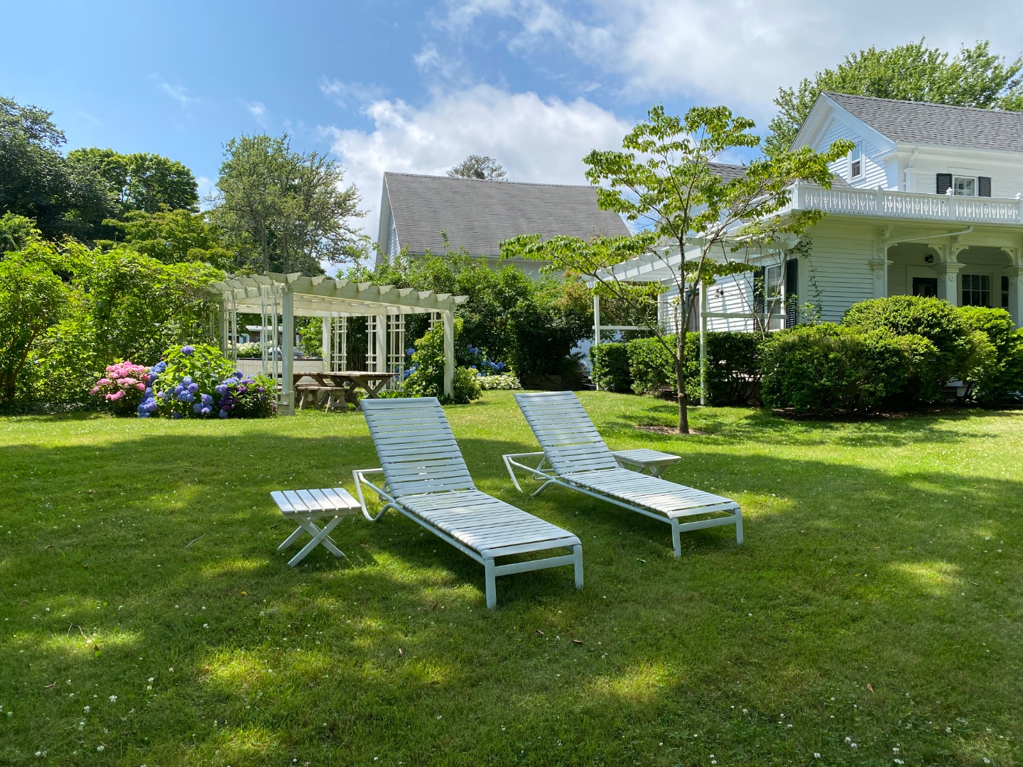 70 Spring Street Vineyard Haven, MA 02568 - Photo 32 of 68 a view of a house with a backyard porch and sitting area