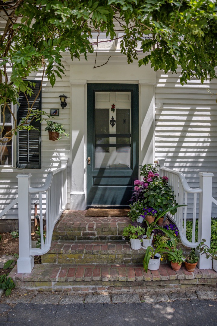 70 Spring Street Vineyard Haven, MA 02568 - Photo 37 of 68 a potted plant sitting in front of a house