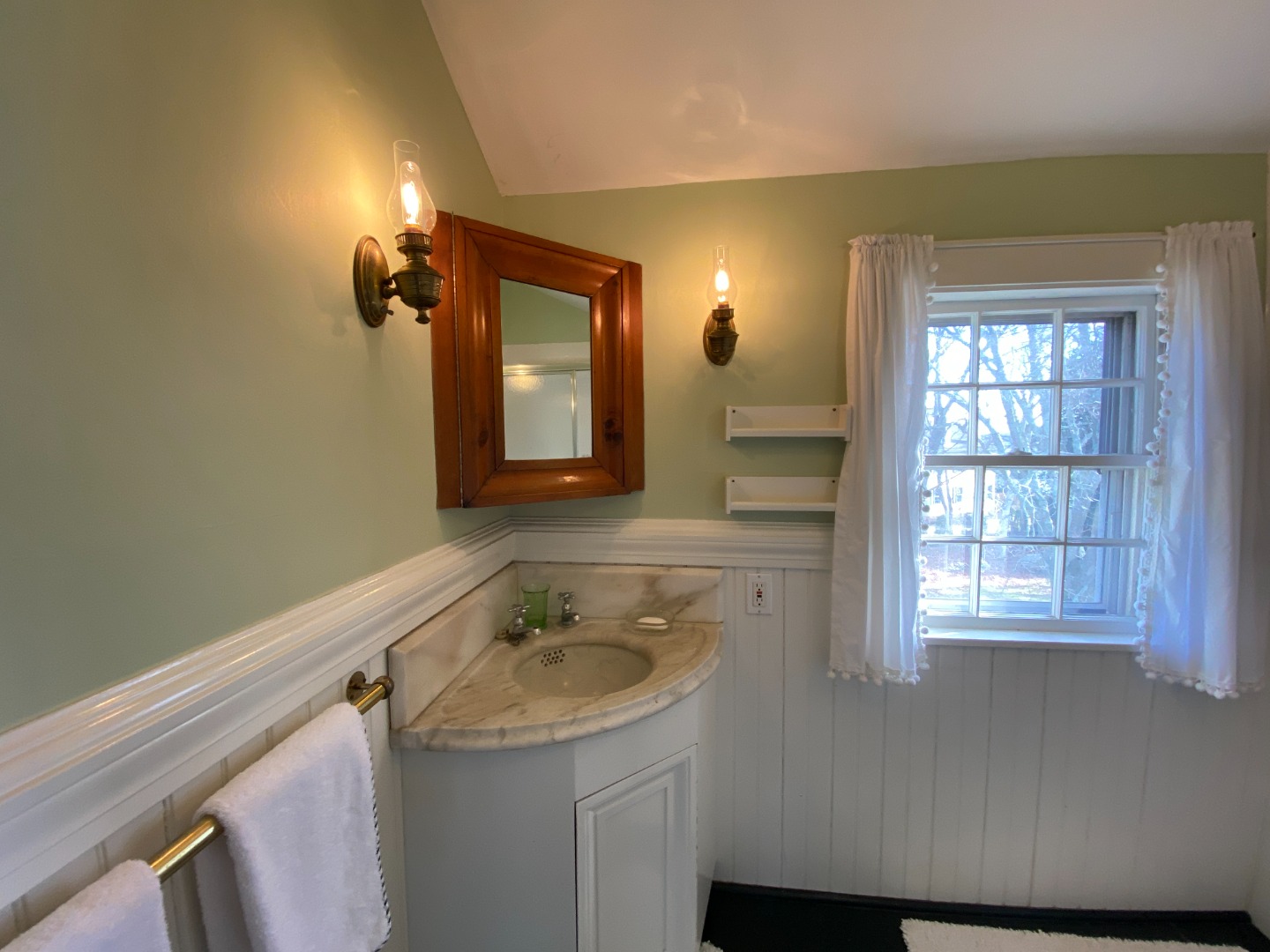70 Spring Street Vineyard Haven, MA 02568 - Photo 49 of 68 a bathroom with a sink and a mirror