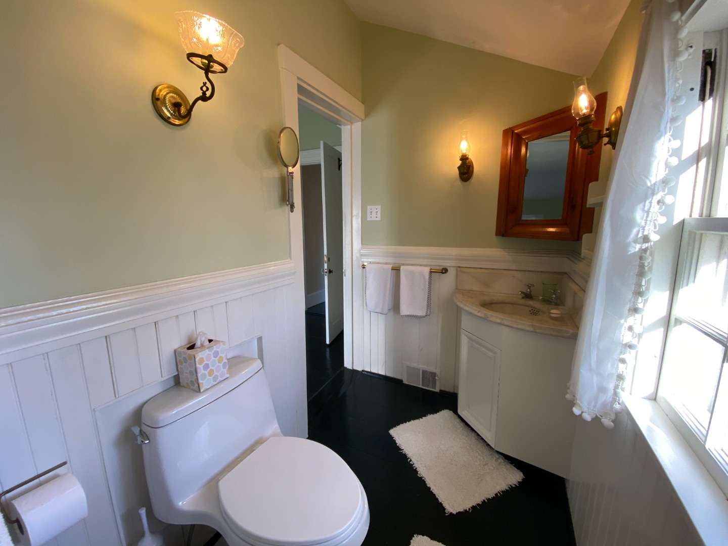 70 Spring Street Vineyard Haven, MA 02568 - Photo 51 of 68 a bathroom with a toilet a sink and mirror