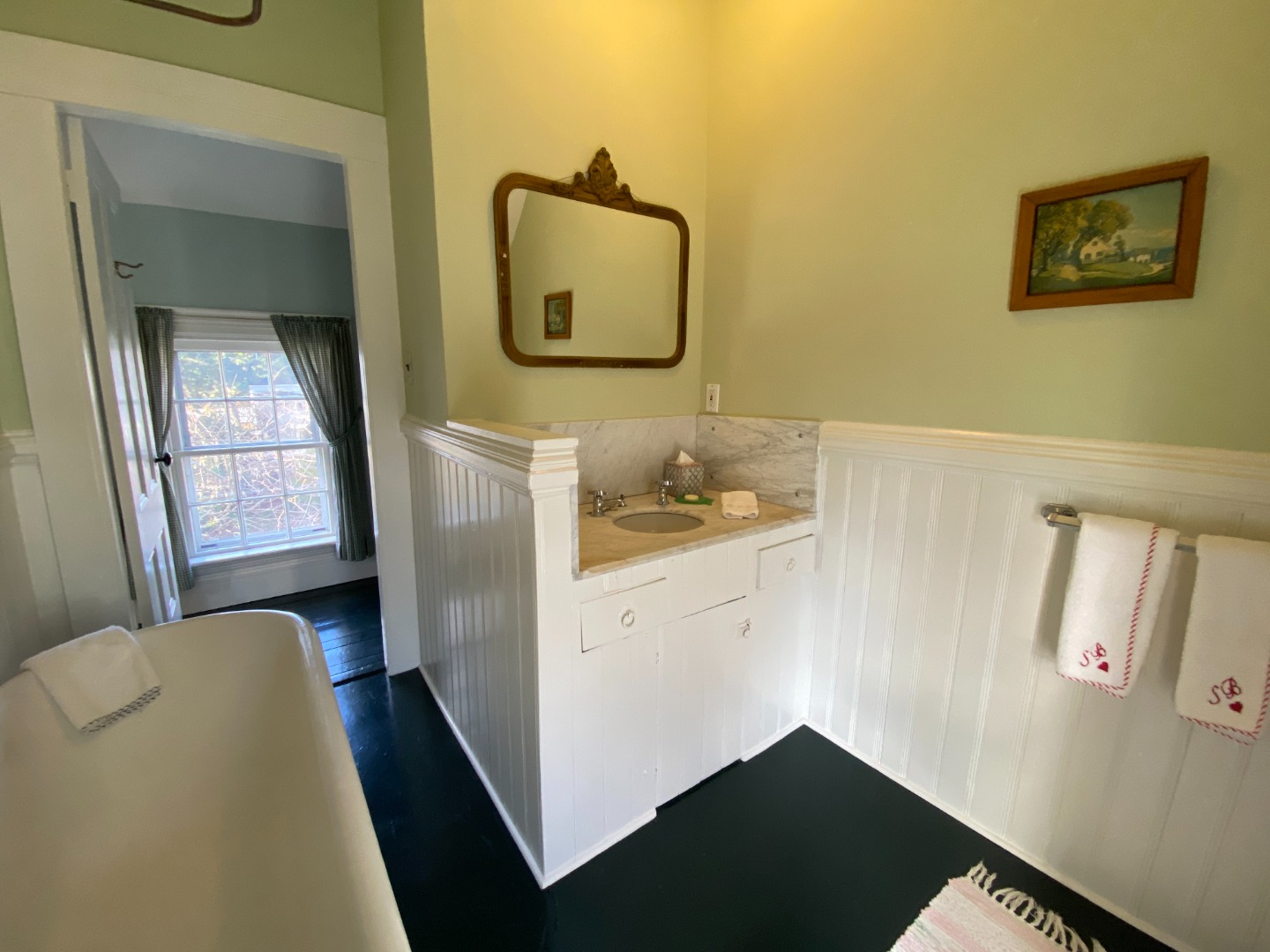 70 Spring Street Vineyard Haven, MA 02568 - Photo 58 of 68 a hallway with a large mirror and a dresser