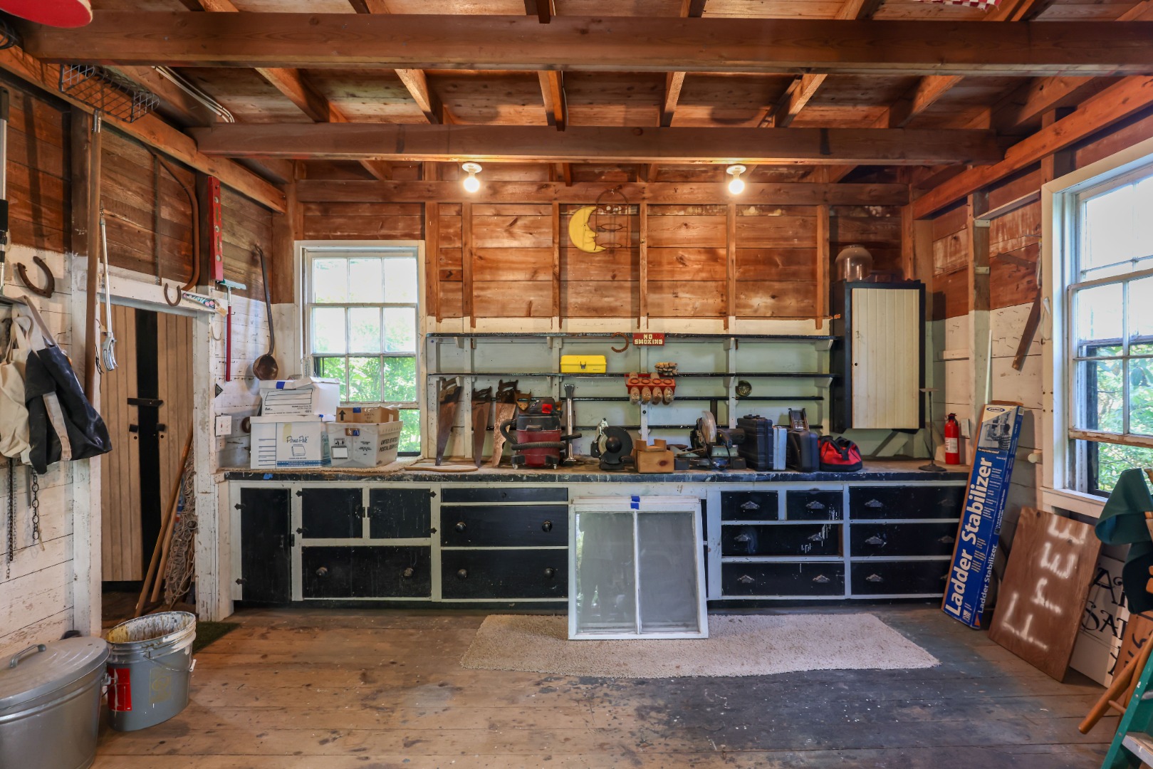 70 Spring Street Vineyard Haven, MA 02568 - Photo 60 of 68 a room with lots of wooden furniture and a large window
