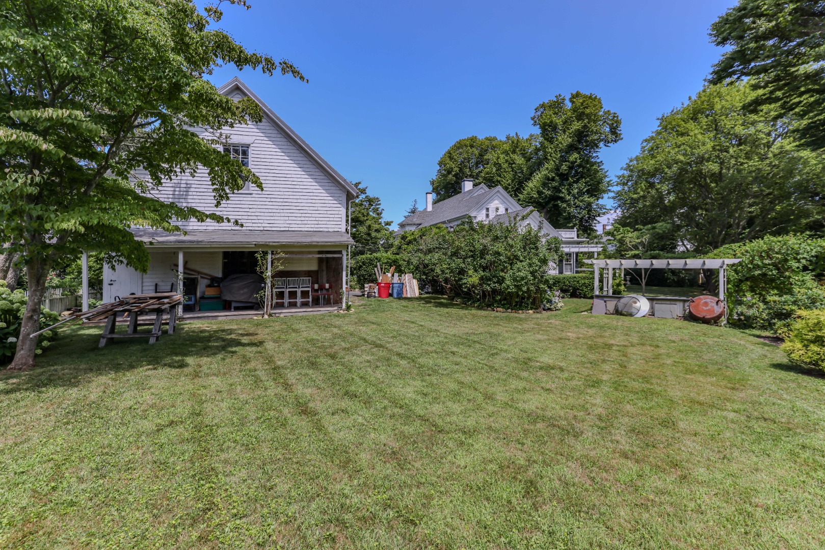 70 Spring Street Vineyard Haven, MA 02568 - Photo 63 of 68 a view of a house with backyard and sitting area