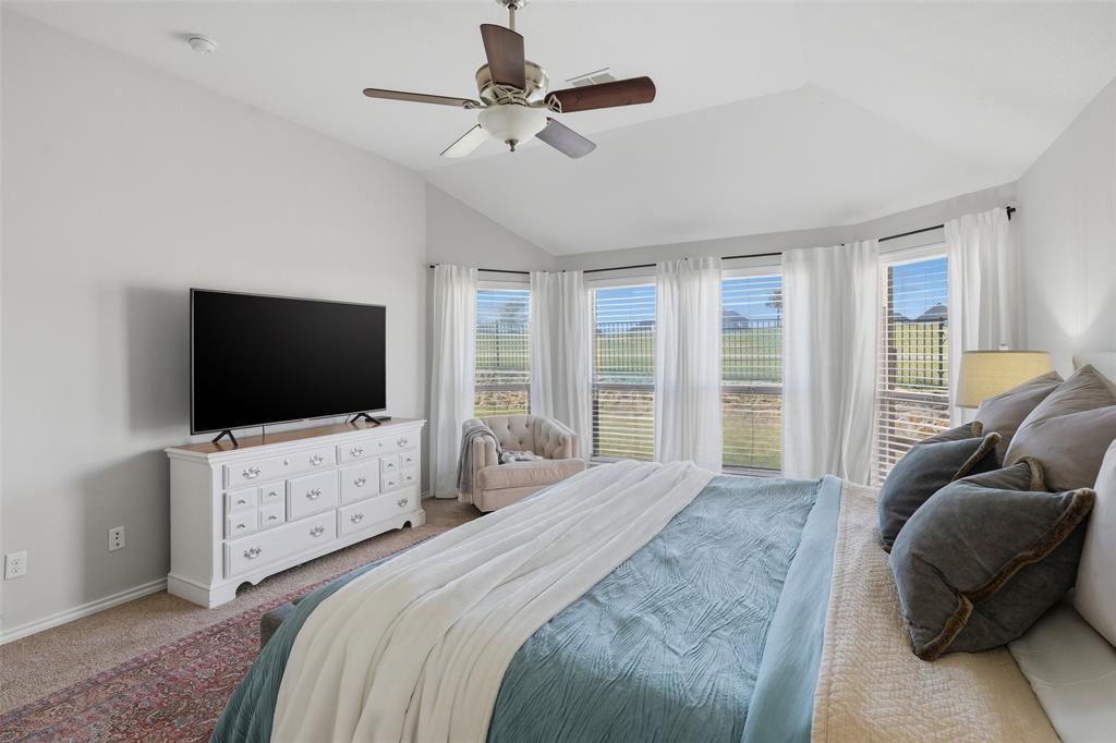 7224 Prestwick Terrace Benbrook, TX 76126 - Photo 12 of 26 a bedroom with a bed a flat screen tv and a couch