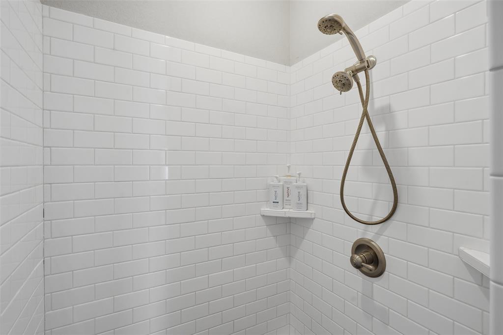 7224 Prestwick Terrace Benbrook, TX 76126 - Photo 15 of 26 a bathroom with a bath tub and a shower