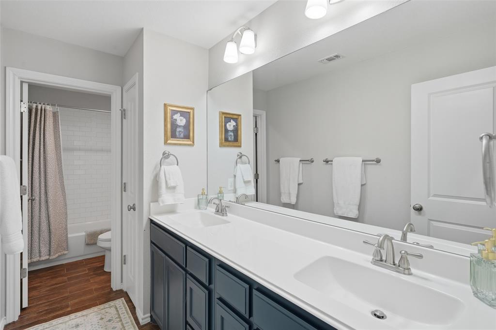 7224 Prestwick Terrace Benbrook, TX 76126 - Photo 17 of 26 a bathroom with a sink double vanity and a mirror