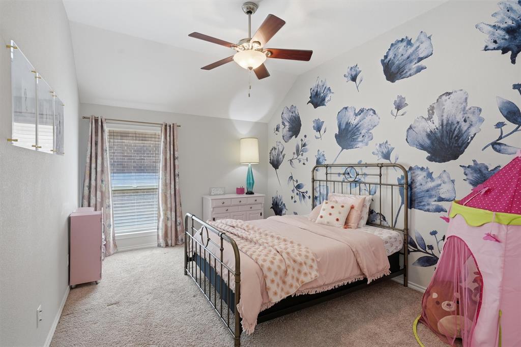 7224 Prestwick Terrace Benbrook, TX 76126 - Photo 18 of 26 a bedroom with a bed and a chandelier