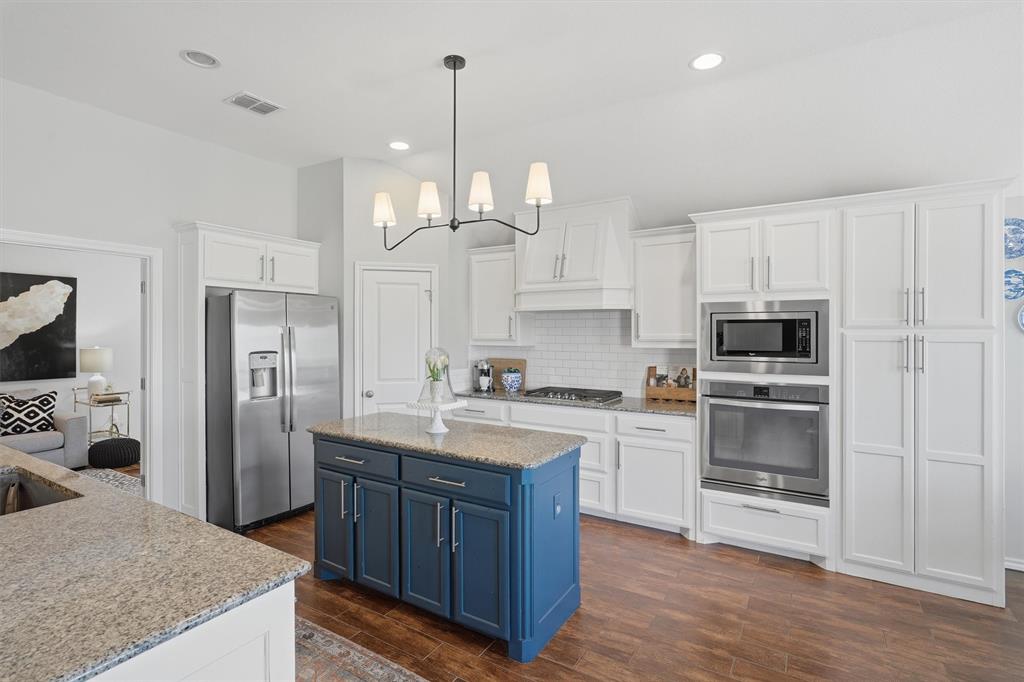 7224 Prestwick Terrace Benbrook, TX 76126 - Photo 5 of 26 a kitchen with a refrigerator a sink and a stove top oven
